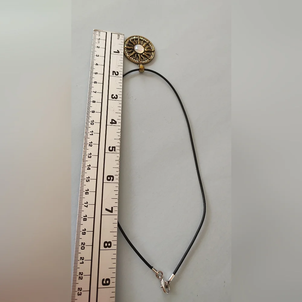 Radiant Gold Sunburst Necklace with Central Gem
